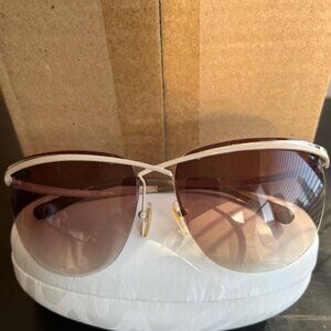 Diane von Furstenberg aviator style sunglasses.